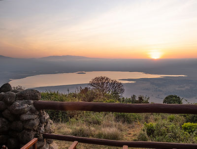 a landscape view of Ngorongoro Crater at sunset