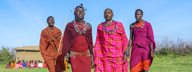 a group of Maasai men performing their traditional jumping dance